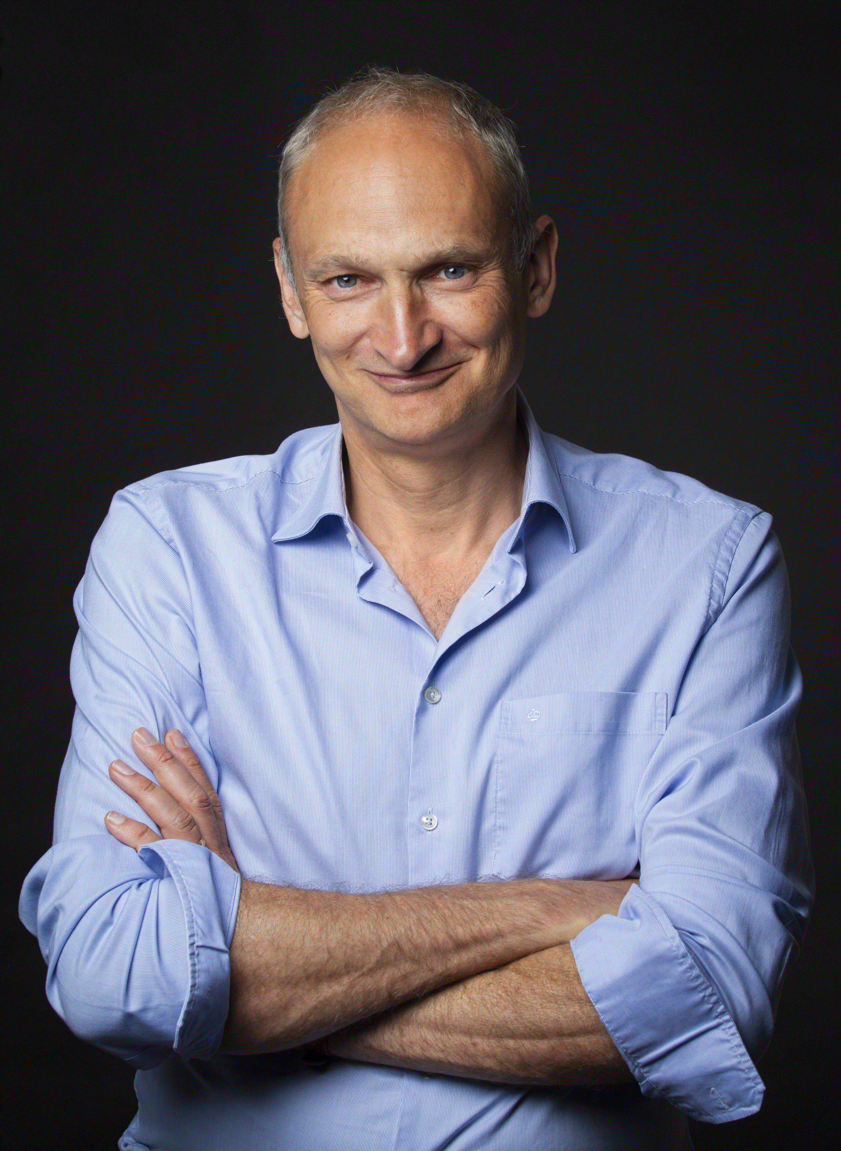 Picture of Professor Nick Megoran, smiling in blue shirt.